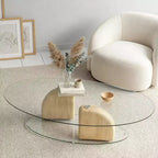 Table basse ovale en verre et béton léger